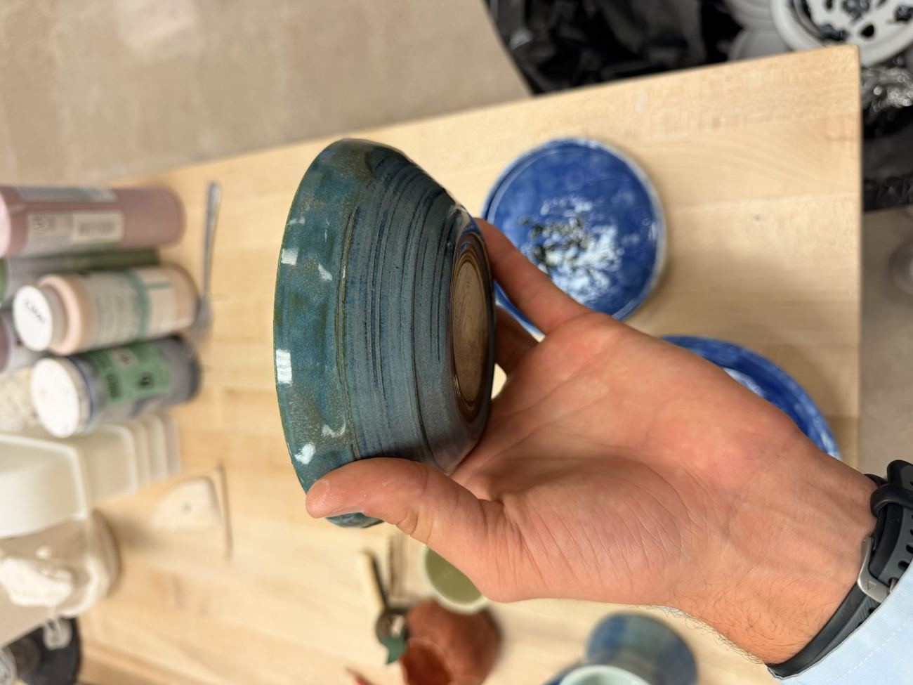Teal bowl, throwing lines showing